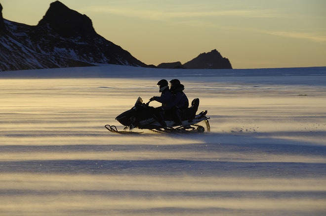 Midnight Sun & Snowmobiling from Husafell