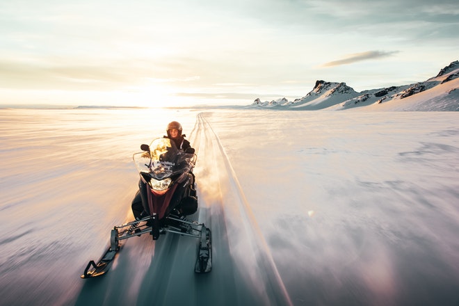 Midnight Sun & Snowmobiling from Husafell